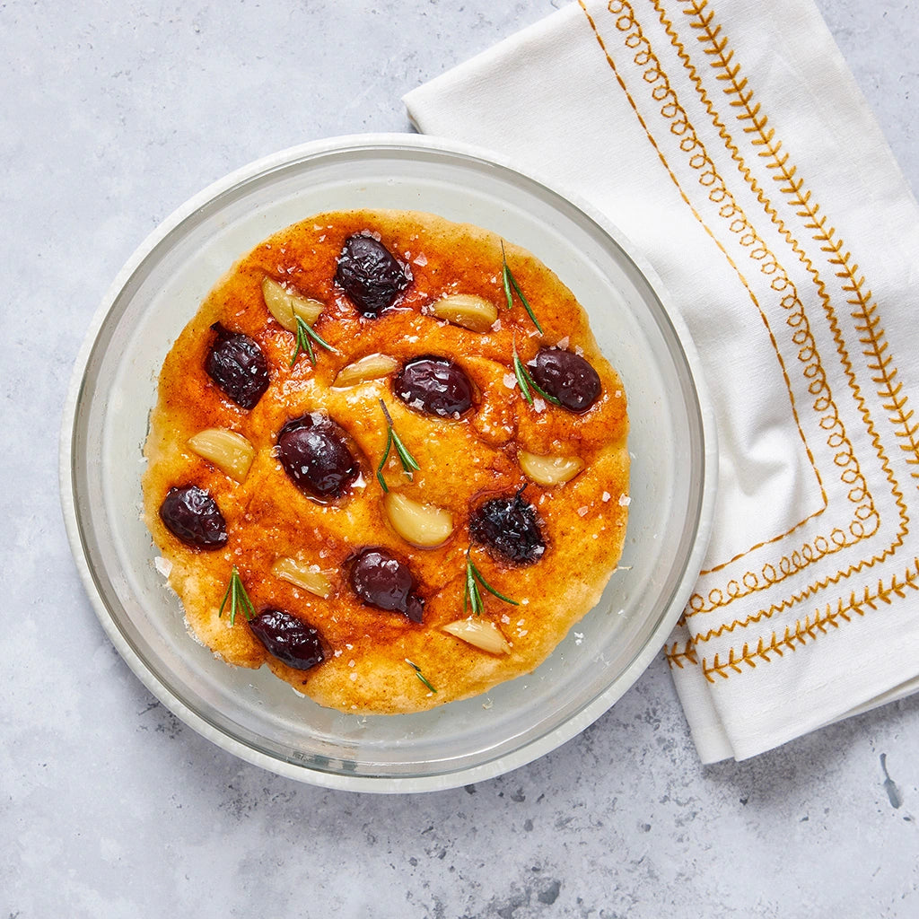 Focaccia-Style Rosemary Quick Bread made and served in the glass Anyday dish, featuring a golden crust with a fragrant rosemary topping.