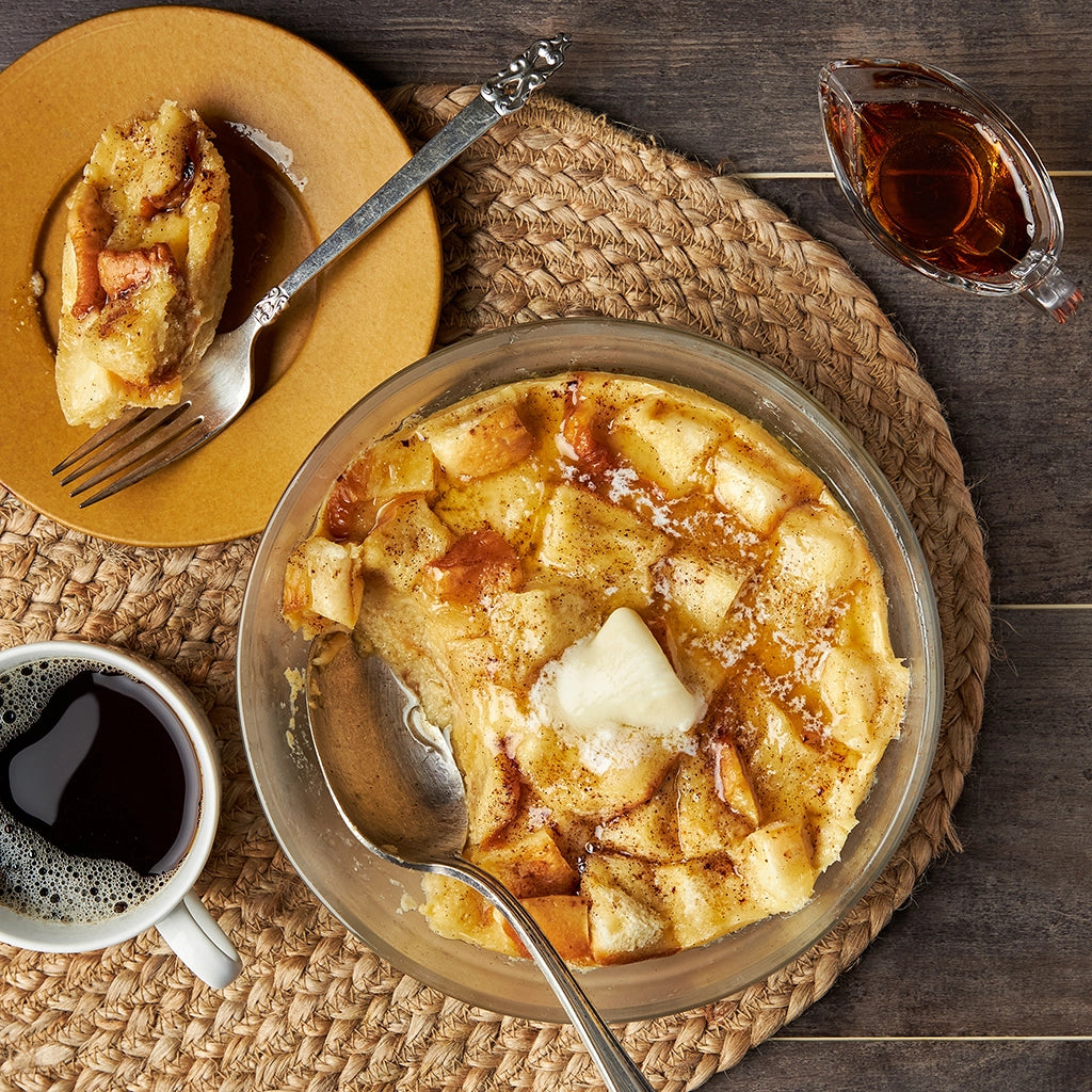 French Toast Pudding made and served in the glass Anyday dish, featuring rich, custardy French bread toast with a hint of cinnamon and topped with fresh berries.