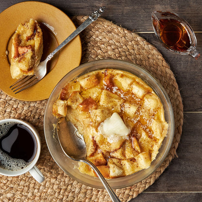 French Toast Pudding made and served in the glass Anyday dish, featuring rich, custardy French bread toast with a hint of cinnamon and topped with fresh berries.