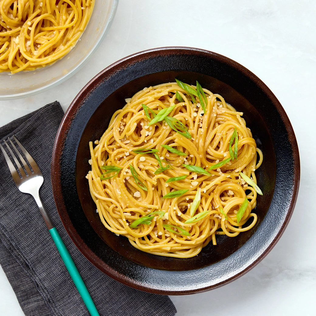 Deliciously flavored San Francisco-style garlic noodles prepared in the microwave using the glass Anyday dish, ensuring no need to pre-boil the water. Enjoy perfectly cooked noodles with rich garlic flavor in minutes, ideal for a quick and satisfying meal.