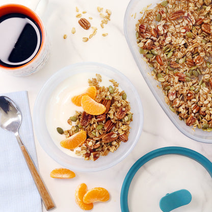 A bowl of homemade maple nut granola, toasted in an Anyday dish in the microwave for a quick, crunchy snack.
