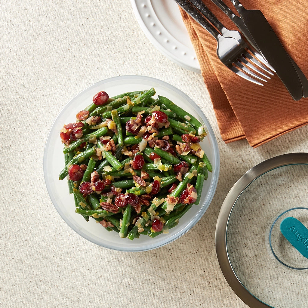 Thanksgiving Green Beans made and served in the glass Anyday dish, featuring tender green beans cooked with savory seasonings and topped with crispy onions.