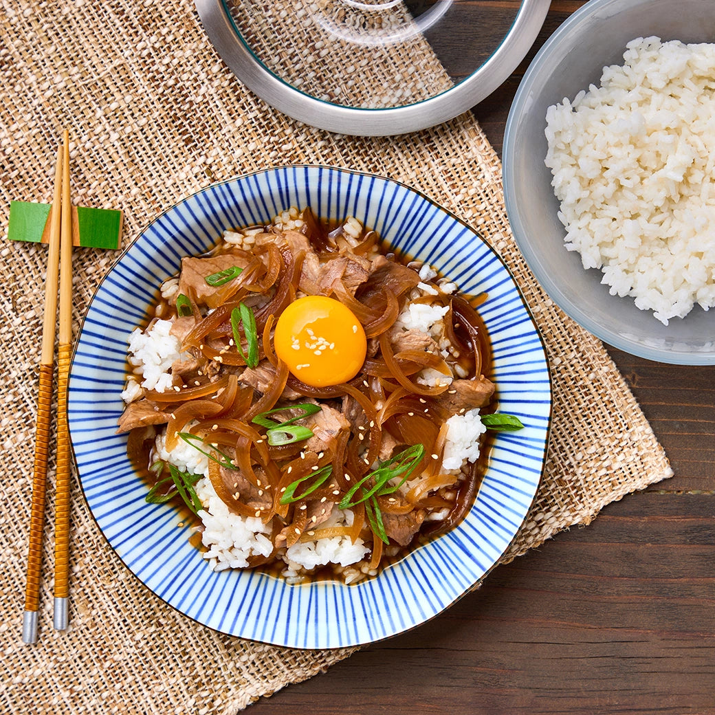 Perfectly simmered Japanese beef gyudon made and served in the glass Anyday dish, showcasing tender beef and flavorful onions. This method ensures a savory one-pot meal, ideal for a quick and satisfying dinner