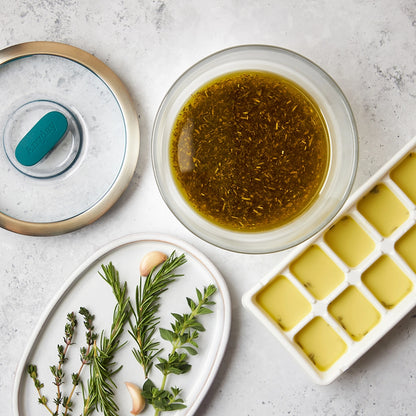 Herb Oil made and served in the glass Anyday dish, with a blend of fresh herbs infused in high-quality oil, perfect for drizzling over dishes or using as a marinade.