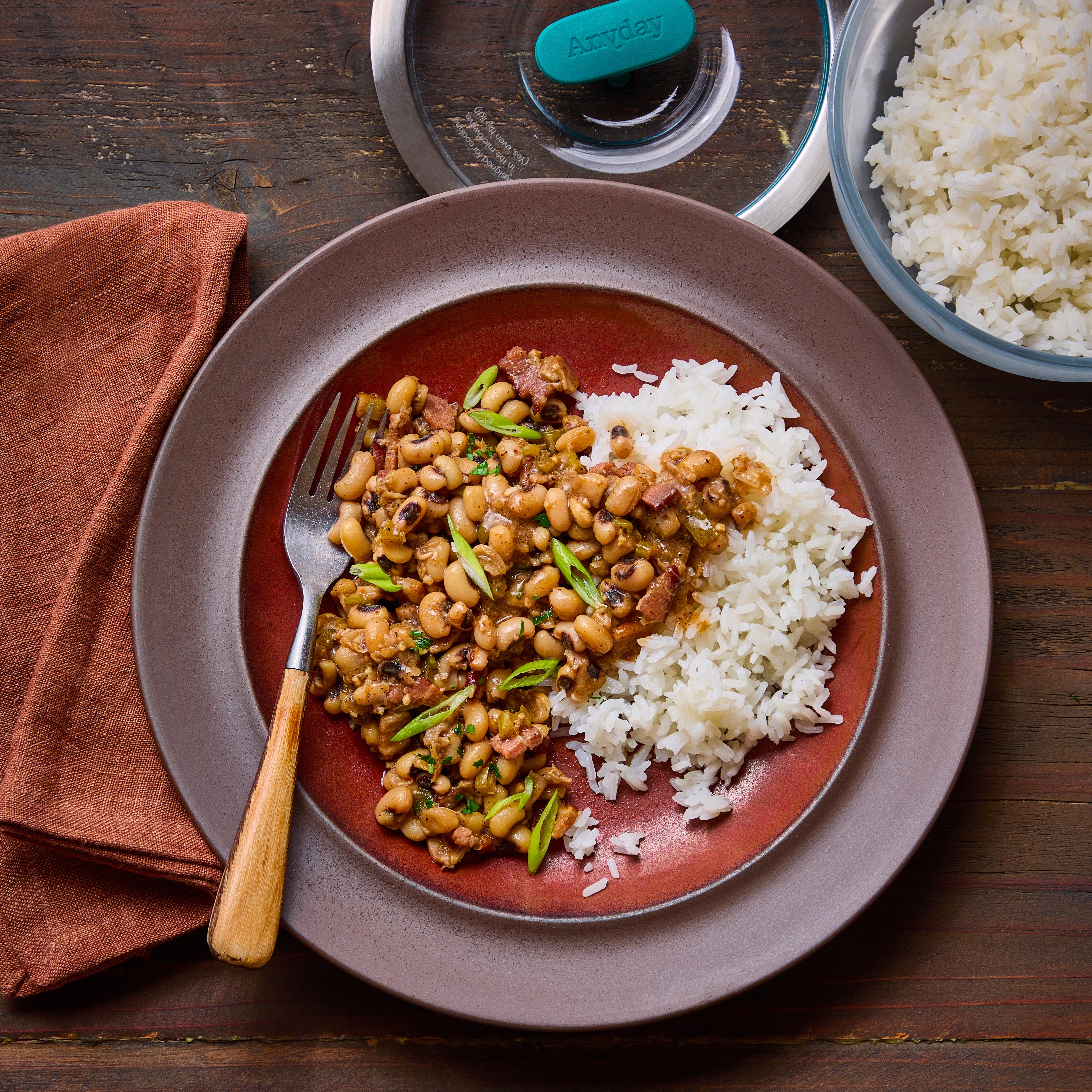 New Year Easy Hoppin' John made and served in the glass Anyday dish, with a flavorful mix of black-eyed peas, rice, and vegetables, perfect for a festive meal.