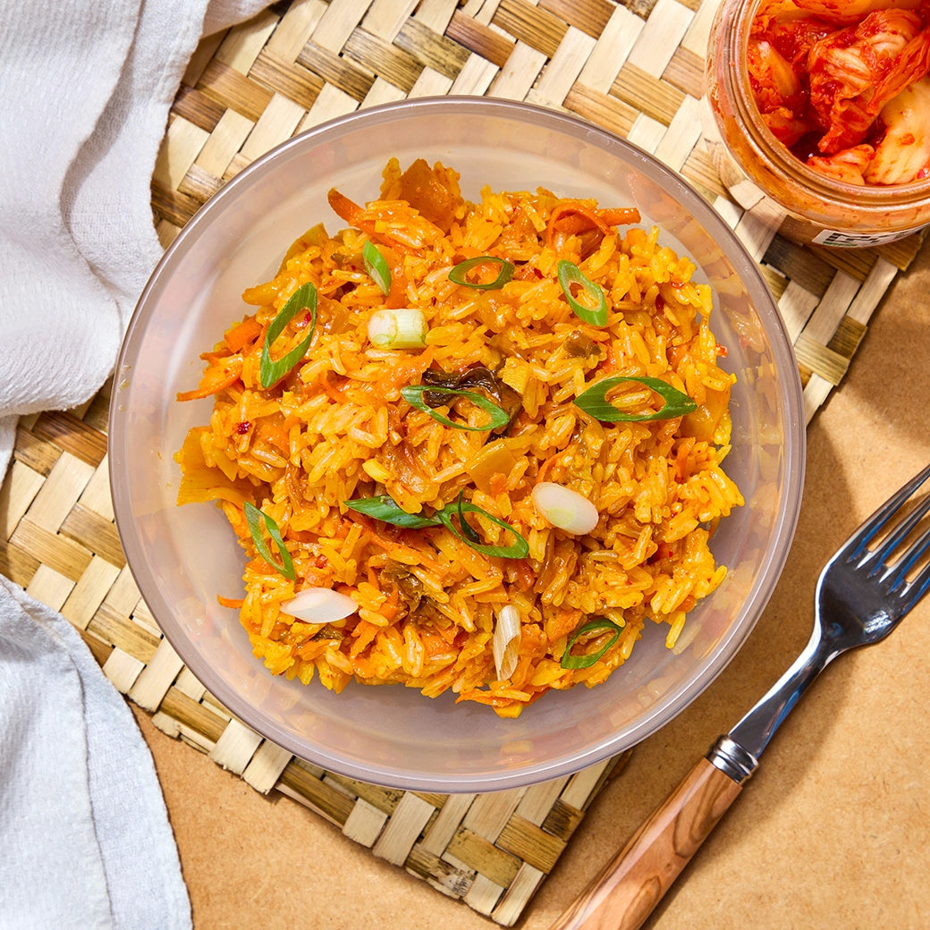 Perfectly cooked Kimchi Fried Rice made and served in the glass Anyday dish, providing a spicy and flavorful rice dish. This method ensures evenly cooked rice with kimchi, ideal for a quick and delicious meal.