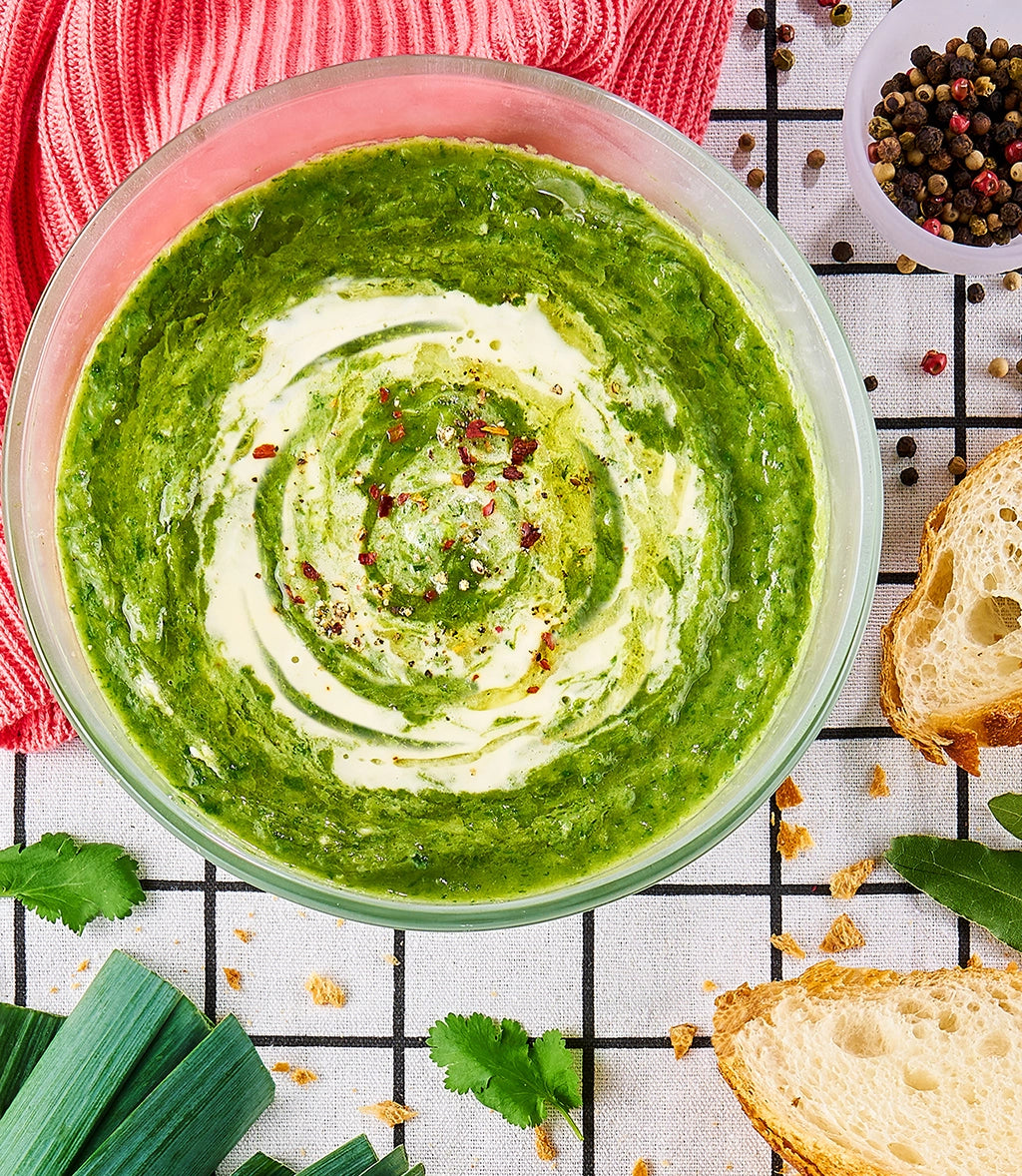 Perfectly cooked Leeks and Greens Soup made and served in the glass Anyday dish, providing a flavorful and nutritious soup. This method ensures tender leeks and vibrant greens, ideal for a comforting meal.