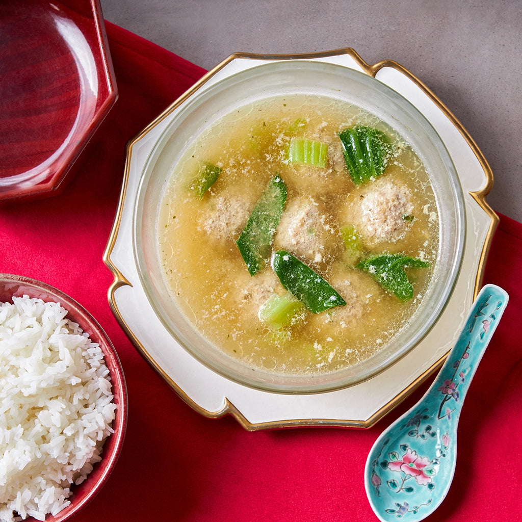 Perfectly cooked Lion's Head Meatballs made and served in the glass Anyday dish, featuring tender pork meatballs infused with ginger, scallion, and sesame oil. This method ensures juicy and flavorful meatballs, ideal for a comforting and delicious meal.