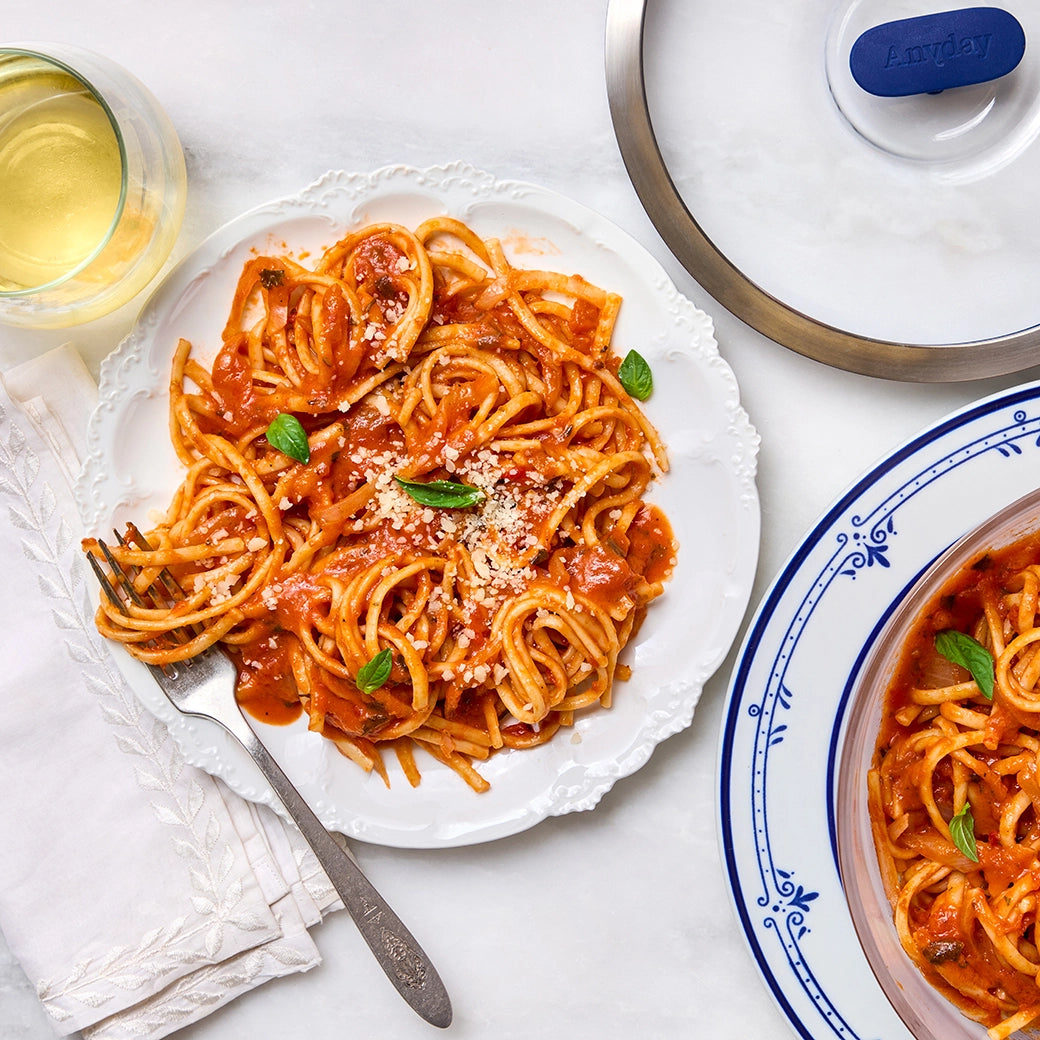 Classic Marcella Hazan's Tomato Butter Pasta made in the glass Anyday dish, consisting of linguini in a rich tomato, butter, and onion sauce. This method ensures perfectly cooked pasta without the need to pre-boil water, ideal for a quick Italian meal.