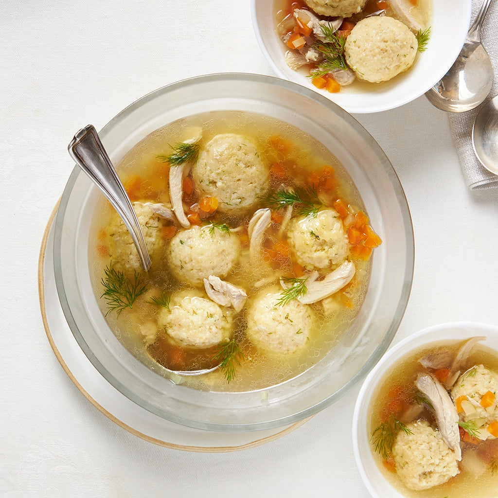 Warming Matzo Ball Soup made in the glass Anyday dish, consisting of tender matzo balls in a flavorful broth with carrots, celery, and dill. This method ensures a comforting and delicious soup, perfect for a cozy meal.