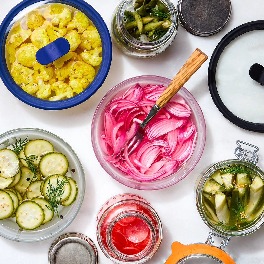 Quick and easy pickles made in the glass Anyday dish, featuring cucumbers and dill in a tangy brine. This method ensures crisp and flavorful pickles, perfect for a refreshing snack or topping.