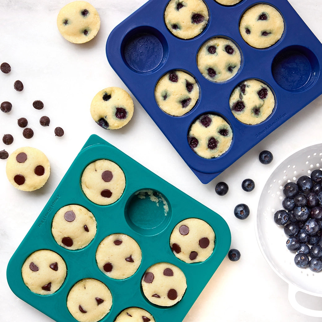 Easy no-oven mini muffins made in the silicone Anytime Freezer Trays, consisting of chocolate chips or blueberries. This method ensures moist and fluffy muffins, perfect for a fun and easy baking activity.