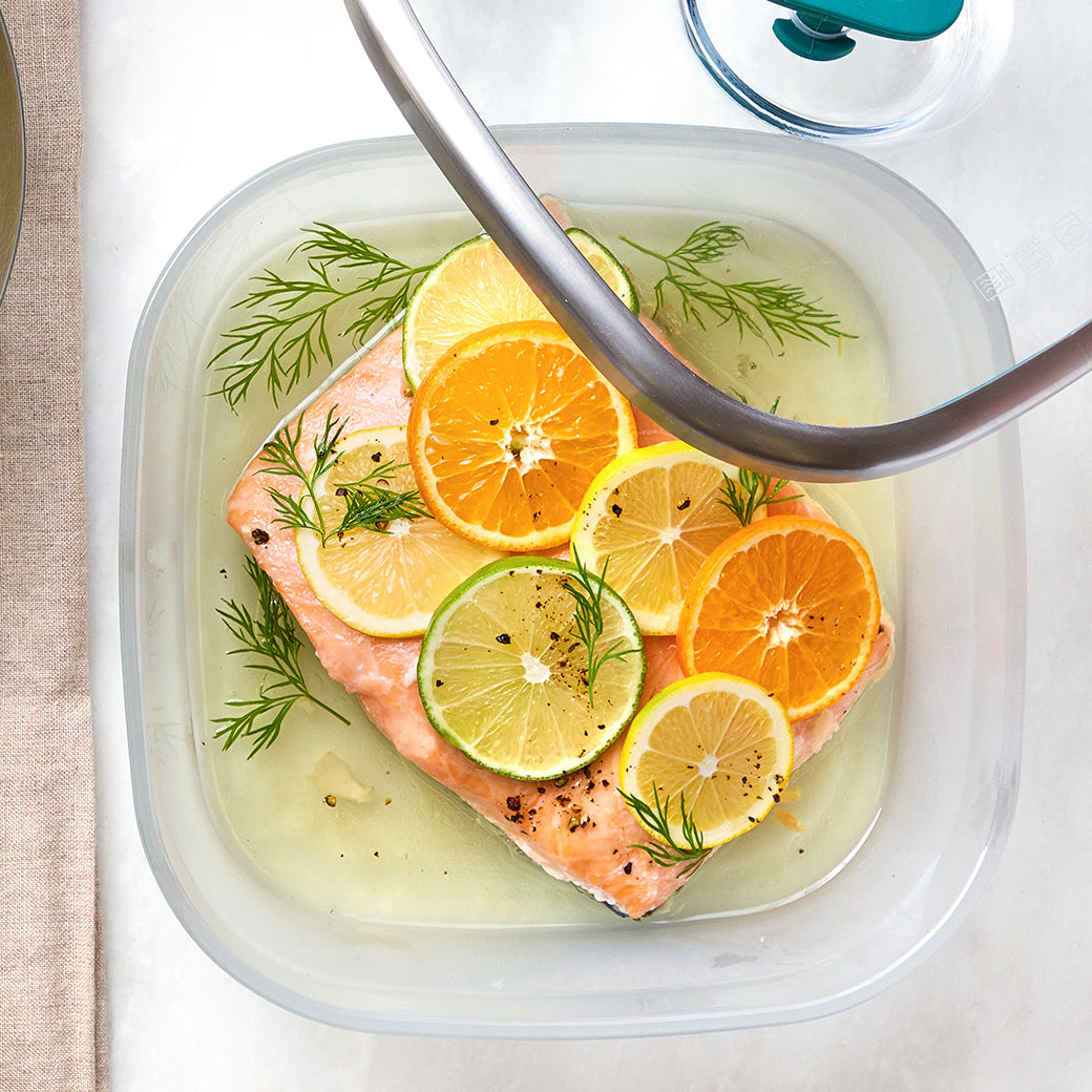 Delicately poached salmon in olive oil, cooked in the glass Anyday dish, ensuring perfectly tender and flavorful fish with no unpleasant odors. This easy and elegant microwave recipe is ideal for a healthy and delicious meal.