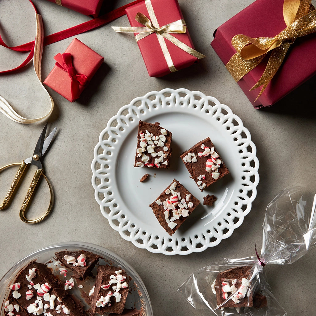 Delicious peppermint fudge made in the glass Anyday dish, featuring a rich and creamy chocolate base infused with refreshing peppermint. This quick and easy microwave recipe delivers a festive and indulgent treat, perfect for holiday gatherings or a sweet snack.