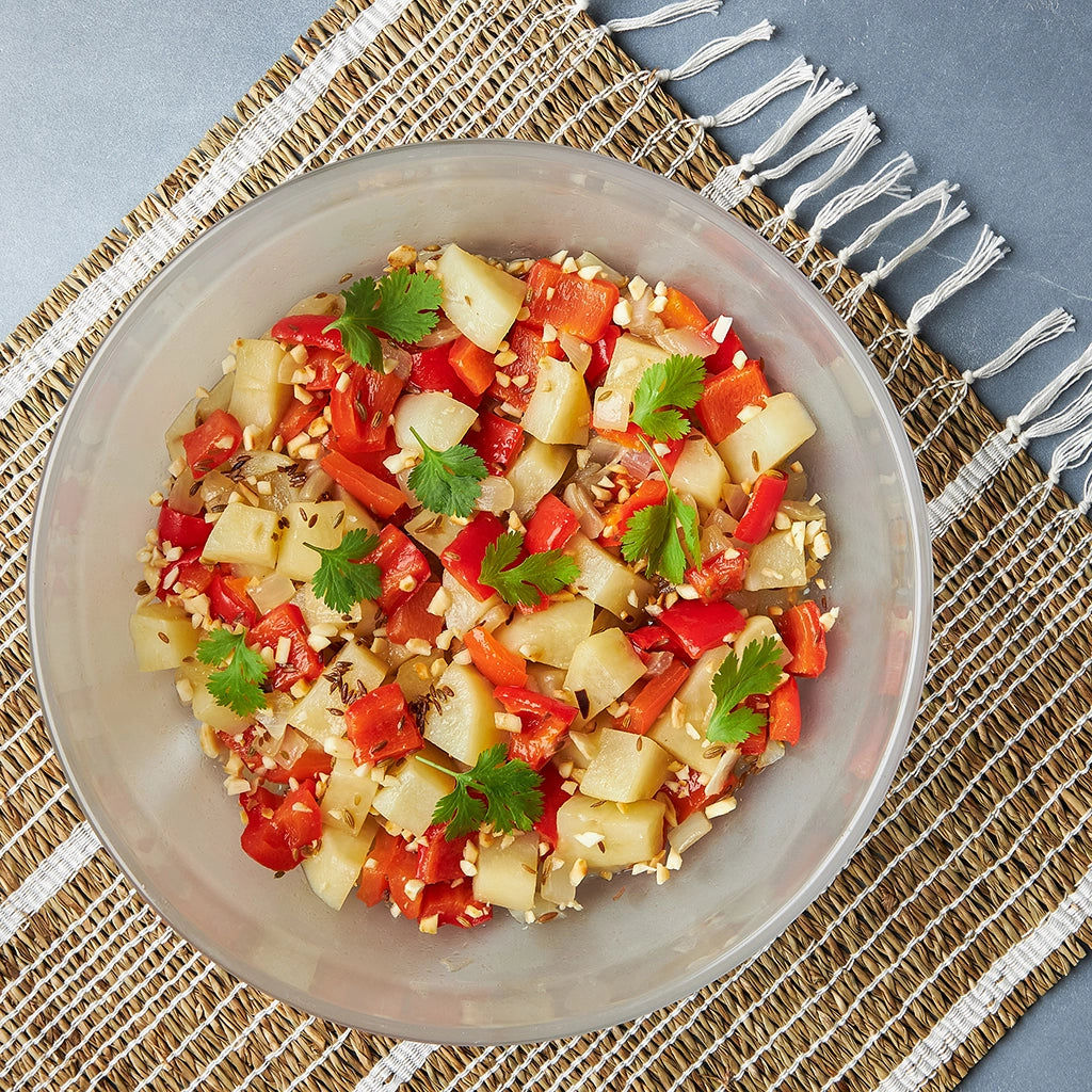 Delicious potato and peanut sabzi made in the glass Anyday dish, featuring tender potatoes and crunchy peanuts cooked with aromatic spices. This quick and easy microwave recipe by Priya Krishna delivers a flavorful and satisfying Indian dish, perfect for any meal.