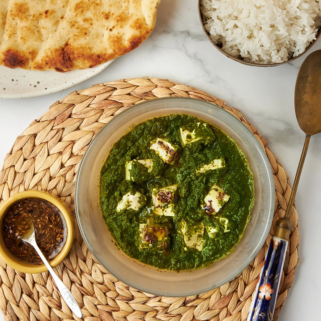 Delicious saag feta made in the glass Anyday dish, featuring creamy spinach cooked with spices and topped with crumbled feta cheese. This quick and easy microwave recipe by Priya Krishna delivers a flavorful and nutritious Indian-inspired dish, perfect for a satisfying meal.