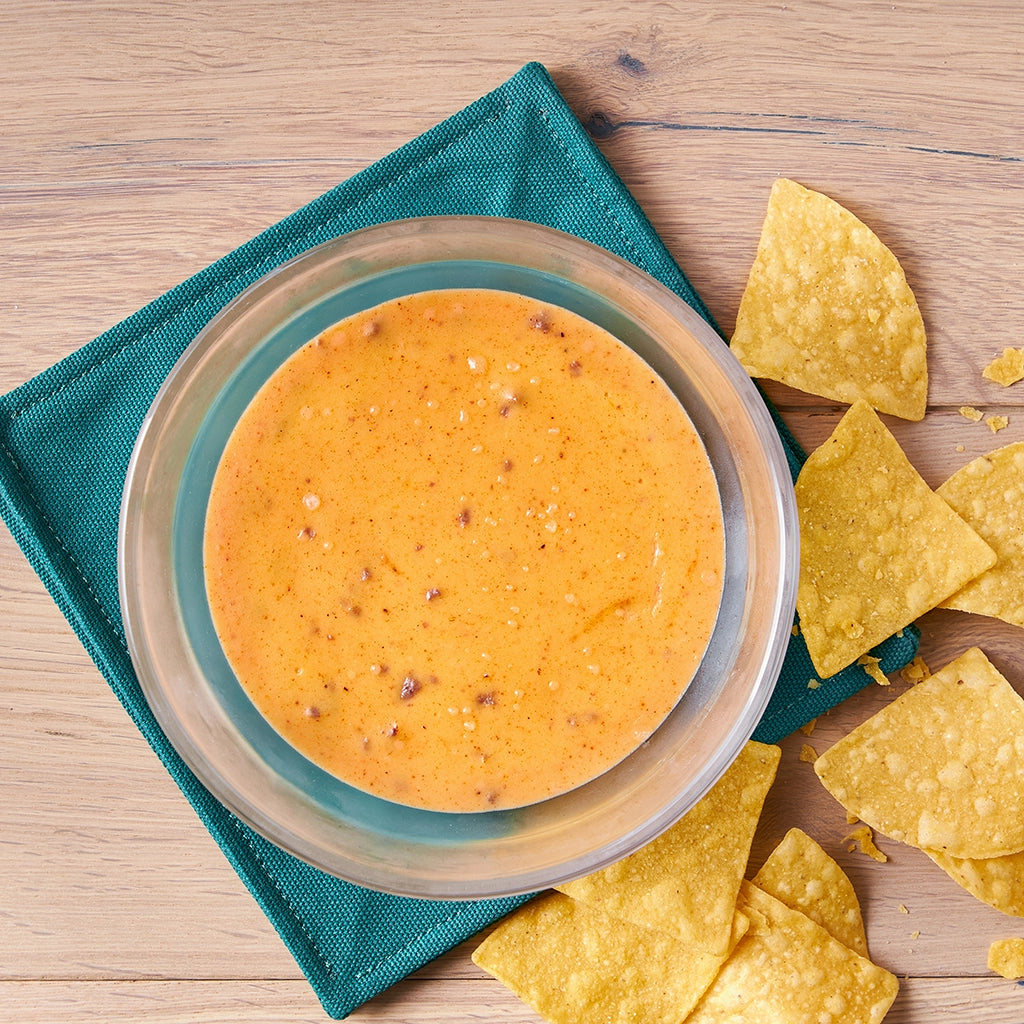 Delicious microwave queso with ground beef made in the glass Anyday dish, featuring melted cheese, savory ground beef, and a blend of spices. This quick and easy recipe delivers a creamy and flavorful dip, perfect for enjoying with chips or as a nacho topping.