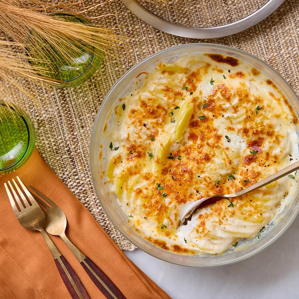 Flavorful scalloped potato gratin effortlessly cooked in the microwave using the glass Anyday dish, delivering perfectly tender potatoes and a rich, creamy sauce in every bite. Ideal for a quick and comforting side dish.