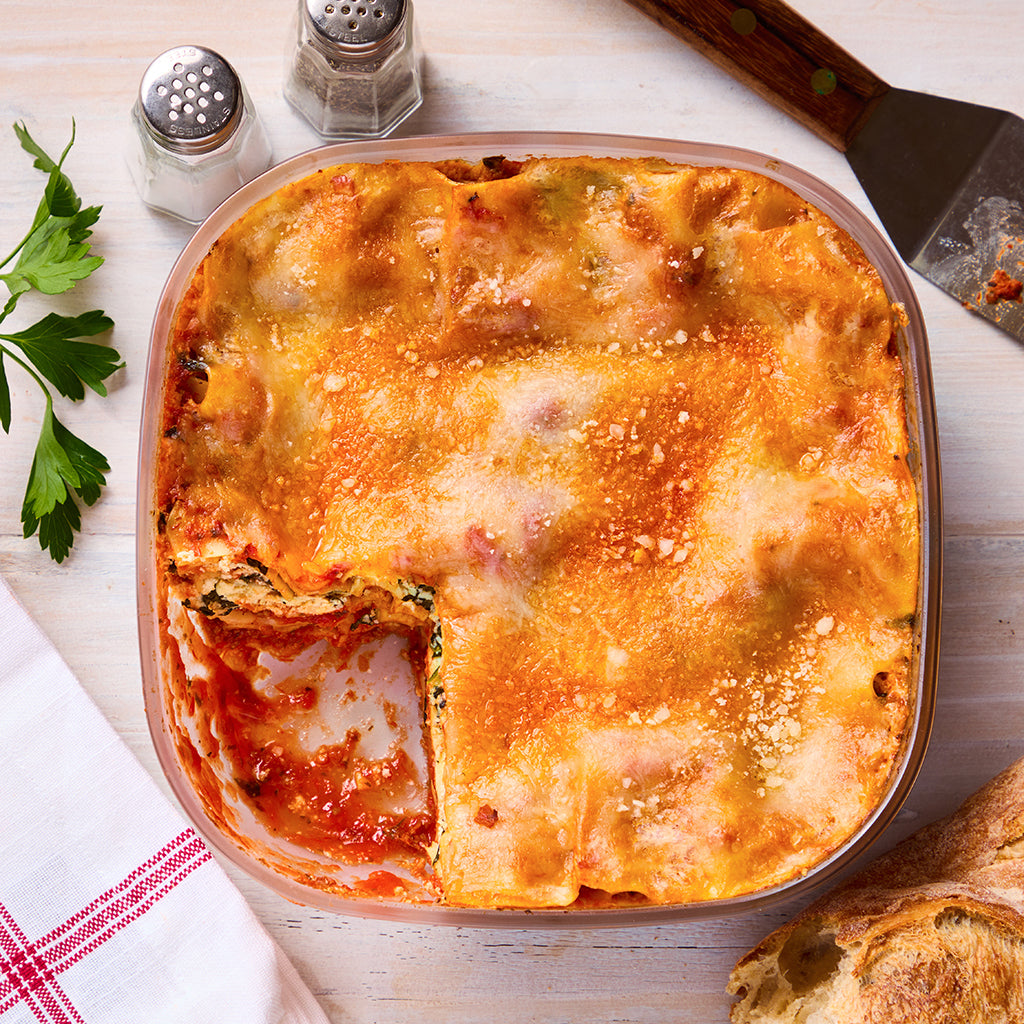 No-bake microwave lasagna made in a square Anyday dish, featuring layers of pasta, rich marinara sauce, and gooey cheese. This quick and easy recipe delivers comfort food without the wait, perfect for a hassle-free meal.