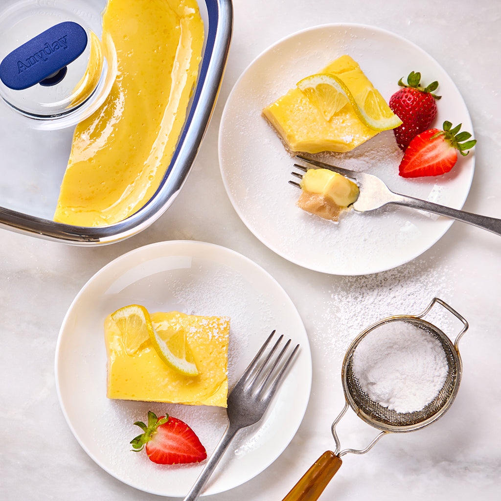 Creamy and tangy lemon bars made in an Anyday dish, featuring a buttery shortbread crust and a smooth lemon filling dusted with powdered sugar. These bright and refreshing treats are perfect for a sweet indulgence any time of day.