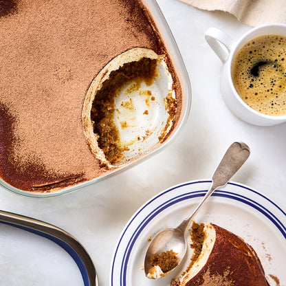Delicious tiramisu is made in an Anyday dish, featuring layers of coffee-soaked sponge cake made in the microwave, rich mascarpone cream, and a dusting of cocoa powder. 