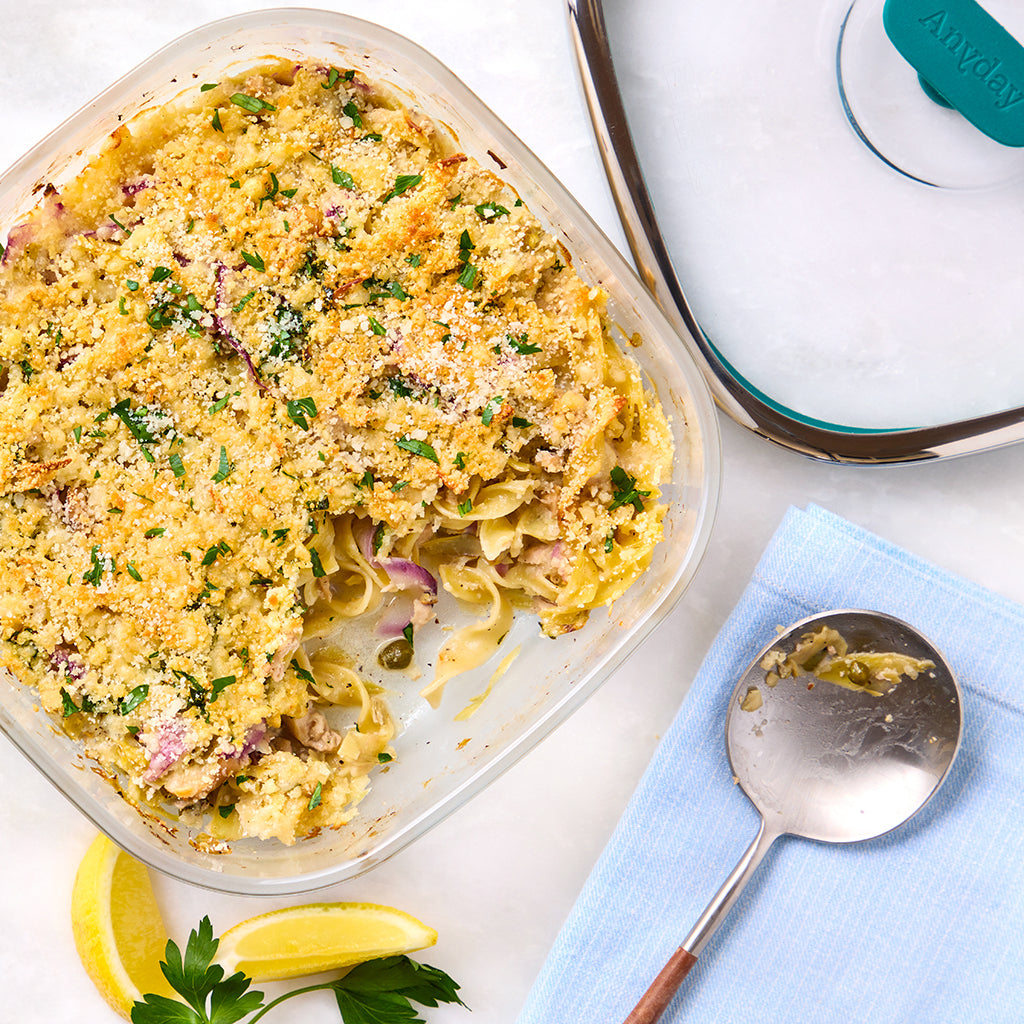 Tuna noodle casserole made in a square Anyday dish in the microwave, featuring tender pasta, tuna, artichokes, capers, and lemon zest. This easy recipe is a comforting, quick meal that's ideal for busy weeknights.