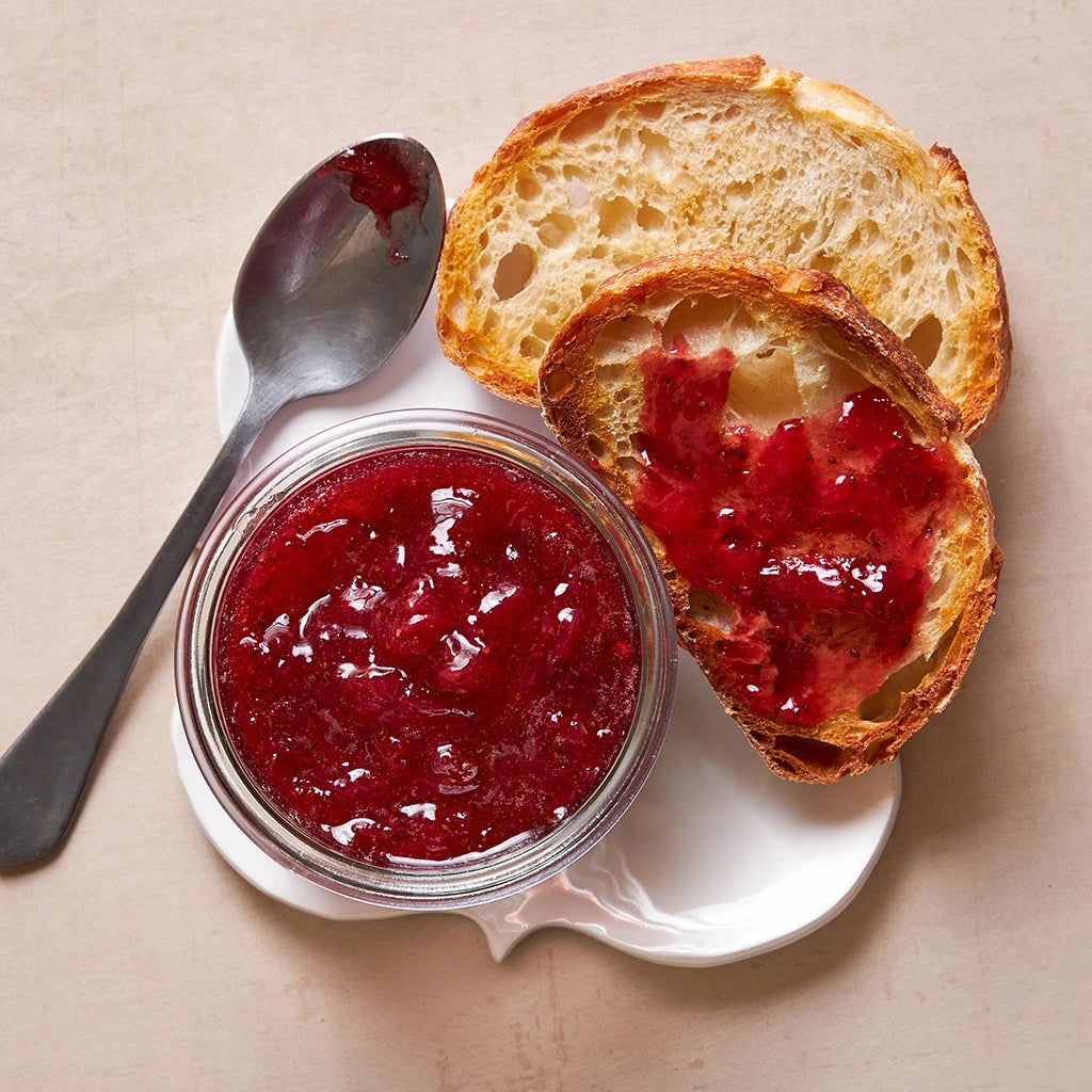 Effortlessly made microwave strawberry jam in the glass Anyday dish, capturing the vibrant color and sweet flavor of fresh strawberries. This quick and simple recipe ensures a delicious spread, perfect for toast or desserts, with minimal prep and cleanup.