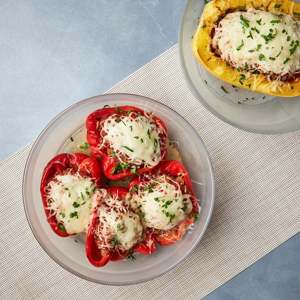 Stuffed spaghetti squash cooked in the microwave using the glass Anyday dish, featuring tender squash filled with savory ingredients. No waiting for the water to boil—enjoy a quick and satisfying meal, ready in minutes.. It can also be made with bell peppers.