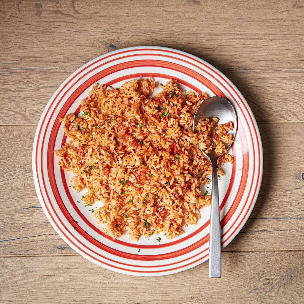 Tomato rice cooked in the microwave using the glass Anyday dish, blending perfectly cooked rice with rich, savory tomato flavors. Enjoy a quick and flavorful side dish, ready in minutes.