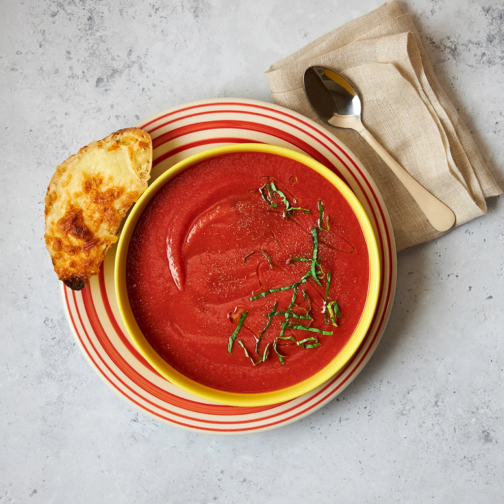 Tomato soup cooked in the microwave using the glass Anyday dish, delivering a rich, smooth, and comforting bowl of soup with deep tomato flavors. Enjoy a quick and satisfying meal, ready in minutes.