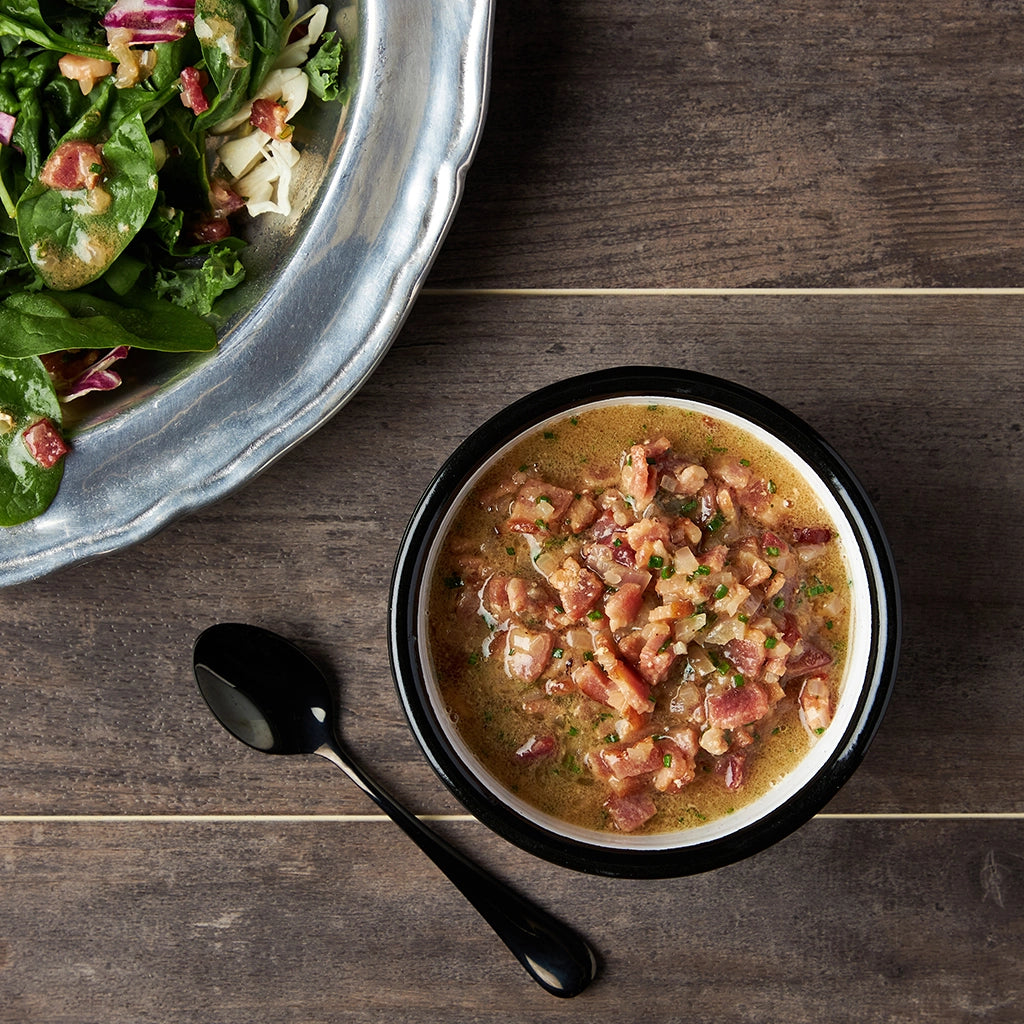 Warm bacon vinaigrette made in the microwave using the glass Anyday dish, delivering a rich, savory dressing perfect for salads or roasted vegetables. Enjoy a quick and flavorful addition to your meals, ready in minutes.