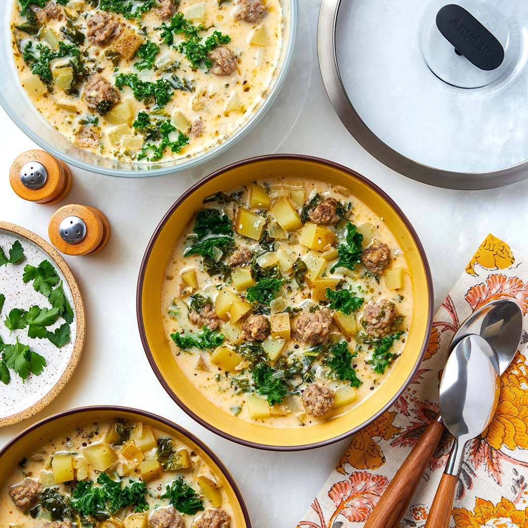 Zuppa Toscana soup made in the microwave using the glass Anyday dish, combining tender potatoes, savory sausage, and kale in a creamy broth. Enjoy a quick and comforting Italian-inspired meal, ready in minutes.