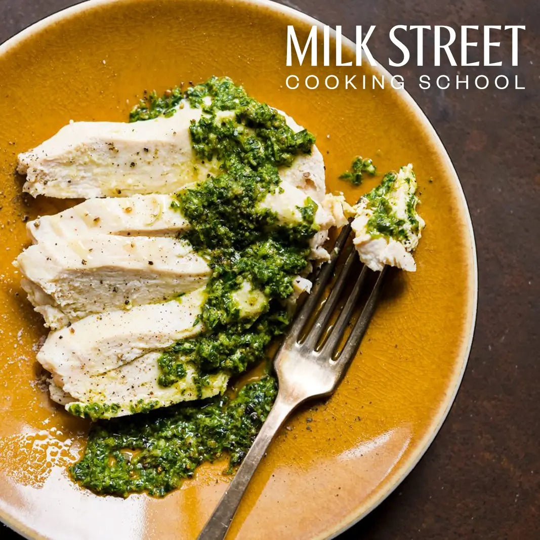 Gently poached chicken in milk by Milk Street Cooking School, made in the glass Anyday dish, ensuring tender and juicy results. This method locks in moisture and enhances flavor, perfect for a comforting and delicious meal.