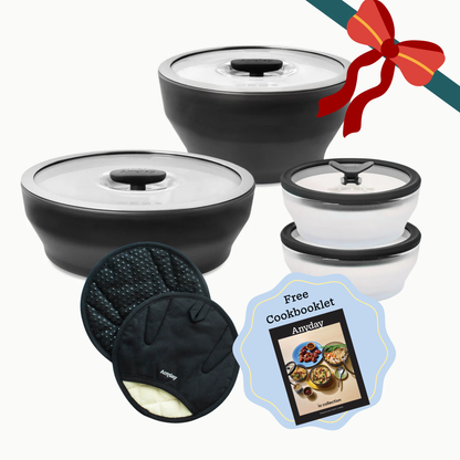 The Onyx Gift Bundle includes two black bowls with glass lids, two smaller white bowls with glass lids, two round potholders, and a gift-wrapped cookbooklet.