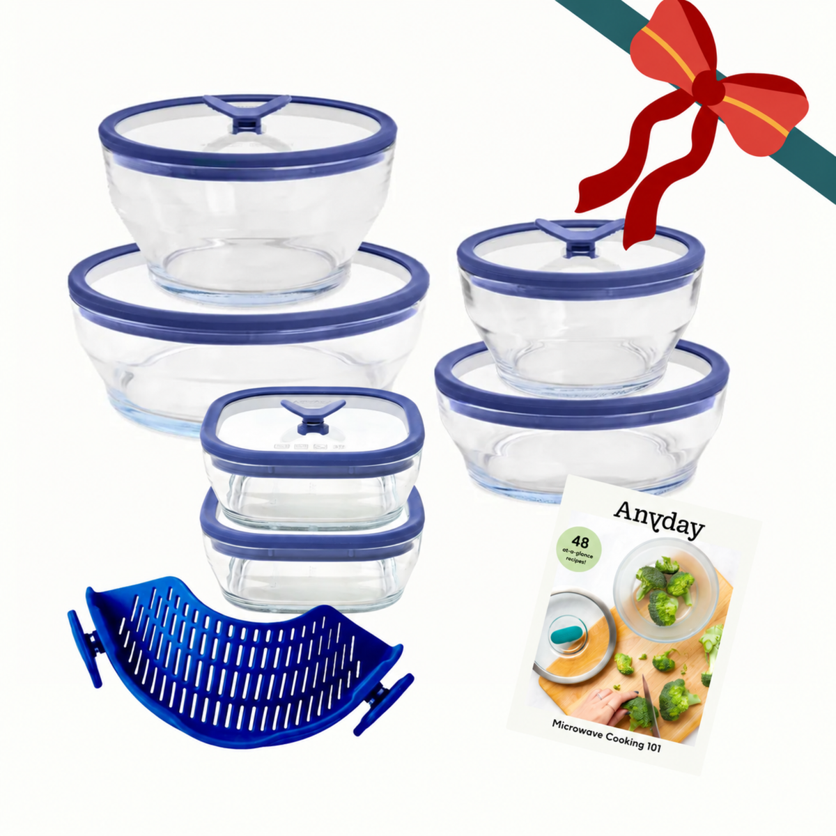 Steph’s Must-Haves (blue) set featuring glass food containers with blue lids, a blue silicone steamer basket, and a recipe booklet tied with a decorative red ribbon.