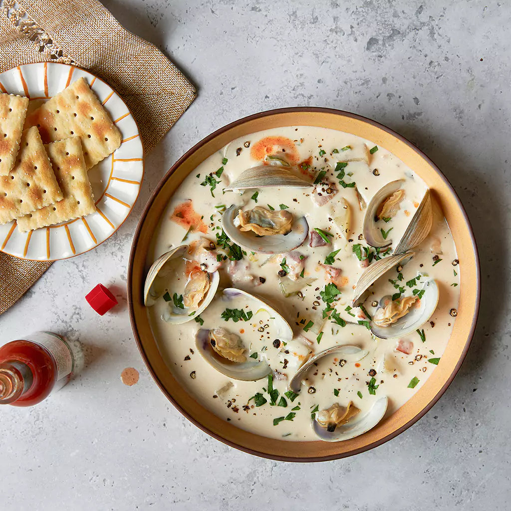 Clam Chowder with Bacon made and served in the glass Anyday dish, featuring a creamy soup with clams, crispy bacon, and potatoes.