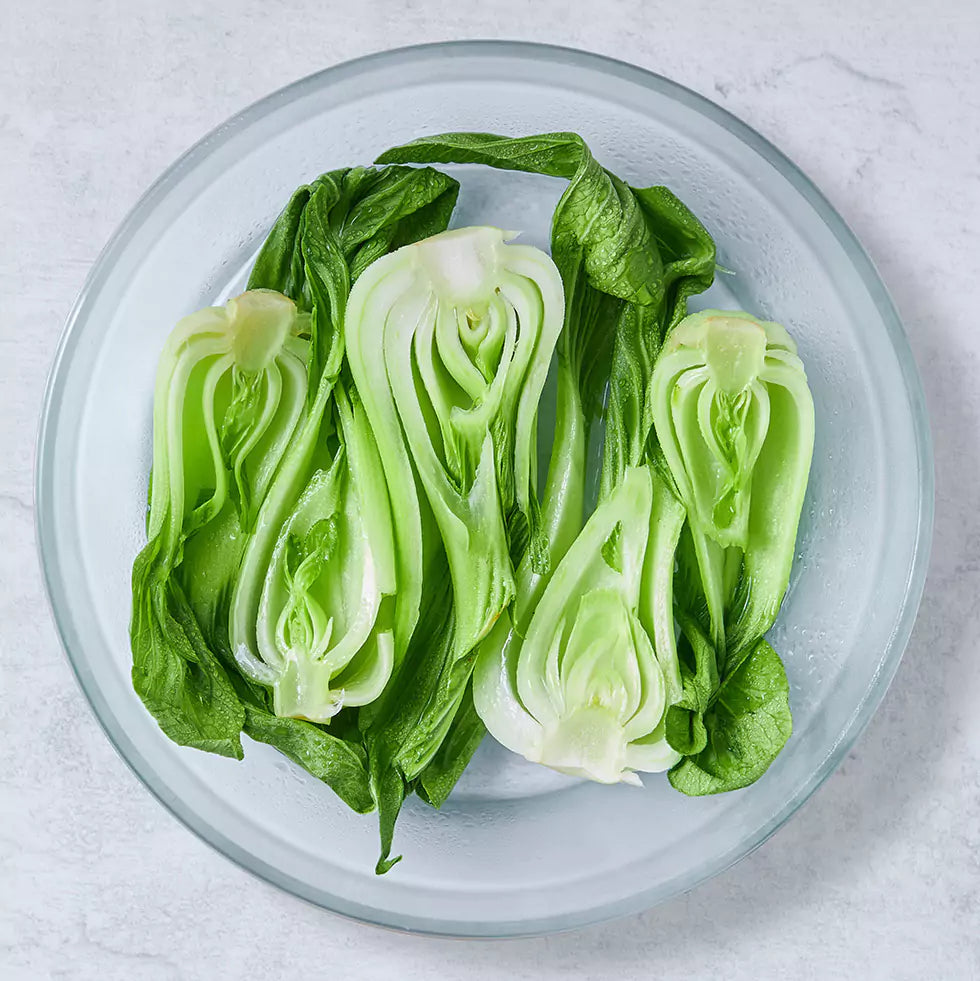 Bok Choy is cooked and served in a glass Anyday dish, featuring tender, steamed bok choy perfect for adding to stir-fries, soups, or as a healthy side dish.